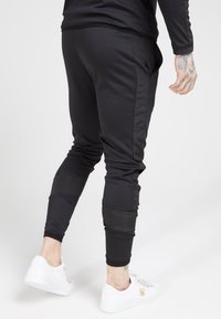 SIKSILK CREASED PANTS - Pantaloni sportivi - black