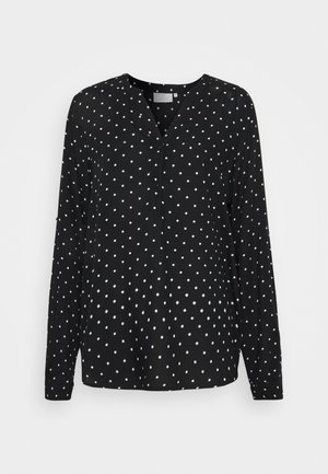 Czarna bluzka z długim rękawem, z dekoltem w kształcie litery V i zapięciem na guziki, ozdobiona wzorem w białe kropki. Miękka tkanina o luźnym i swobodnym kroju.