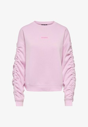 Light pink sweatshirt with ruched long sleeves and "STUDIO" printed in small pink letters on the chest.