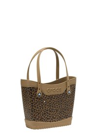 Tassentas met luipaardprint, gemaakt van flexibel rubber met beige accenten en dubbele handvatten. Heeft een gestructureerde basis en logo-detail.