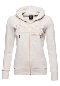 Felpa con zip color crema, con zip dorata, logo ricamato sul davanti, cappuccio regolabile con cordino e polsini e orlo a coste.
