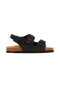 Sandale noire à bout ouvert avec semelle en liège, deux brides ajustables à boucle sur le dessus du pied, et une bride arrière à boucle pour le maintien de la cheville.