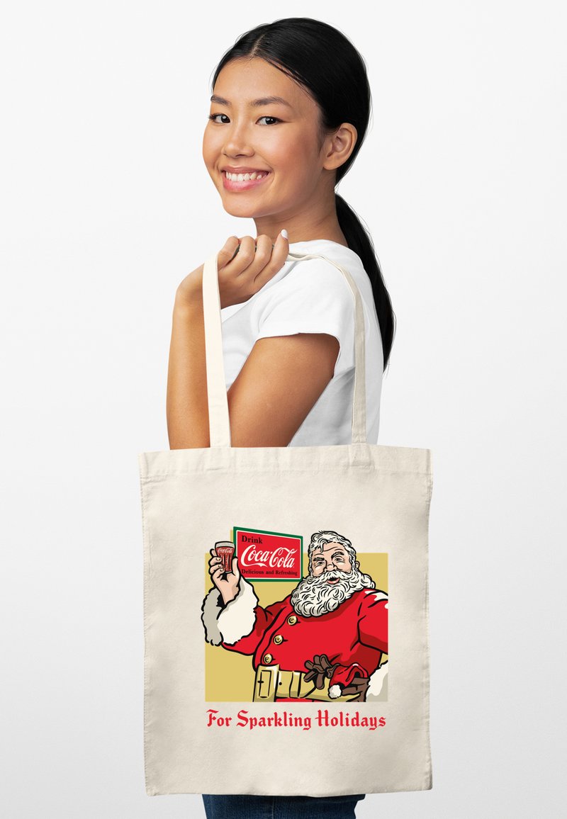Torba na zakupy z płótna z ilustracją vintage Świętego Mikołaja, w czerwono-białe akcenty, z napisem "Na Błyszczące Święta" oraz logo Coca-Cola.
