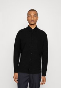 Schwarzes Langarmhemd aus strukturiertem Stoff, mit Button-Down-Kragen und Knöpfen vorne, ergänzt durch einen geraden Saum.