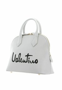 Gray handbag with dual short handles, structured shape, black "Valentino" logo, smooth textured material, and gold zipper hardware.