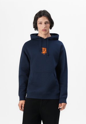 Navy blue hoodie with front pocket, drawstring hood, and an orange logo on the chest. Made of soft fabric, featuring a standard fit.