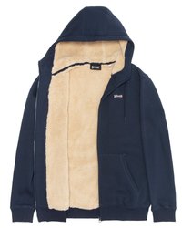 Sudadera con cremallera de color azul marino, con forro de felpa beige, bolsillos frontales y el logo "Schott NYC" en el pecho y en el interior del cuello.