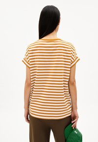 Striped short-sleeve t-shirt with orange and white stripes, round neckline, and a relaxed fit. Smooth cotton material.