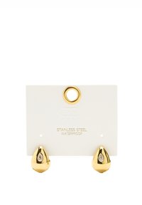 Stalowa karta ze stali nierdzewnej na białym tle, z okrągłym złotym otworem i złotymi akcentami w kształcie kropli z przezroczym detalem gemowym. Wodoodporna.