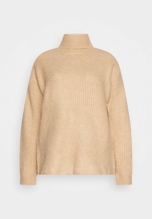 Pull à col roulé beige en grosse maille avec manches longues et texture côtelée, présenté sur un fond gris neutre.