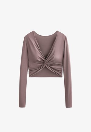 Bluza crop cu mâneci lungi de culoare lavandă, decolteu adânc în V și detaliu cu nod răsucit în centrul din față.