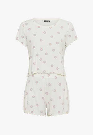 Ensemble de détente côtelé blanc avec manches courtes et bords festonnés, présentant un motif floral en rose et bleu sur le haut et le short.