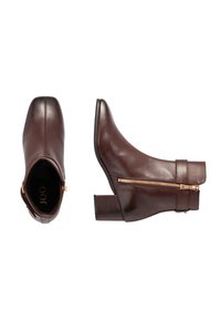 Brown leather ankle boots feature a rounded toe, mid-height block heel, and a side zipper with gold hardware detail. Smooth texture.