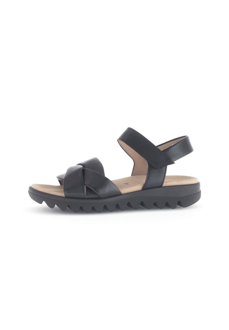 Zwarte leren sandalen met kruisbanden, gevoerd voetbed en een gestructureerde, geribbelde rubberen zool voor grip. Verstelbare enkelband.