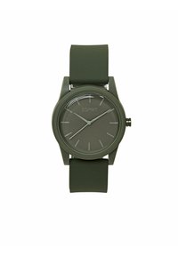 Grøn silikonesnor ur med en rund, mat grøn urskive, der har sølv timemarkører og visere. Displayet inkluderer en lille krone på siden.