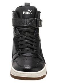 Black high-top sneaker with a textured leather upper, black laces, ankle strap, and a white midsole. Features Puma logo on the tongue.