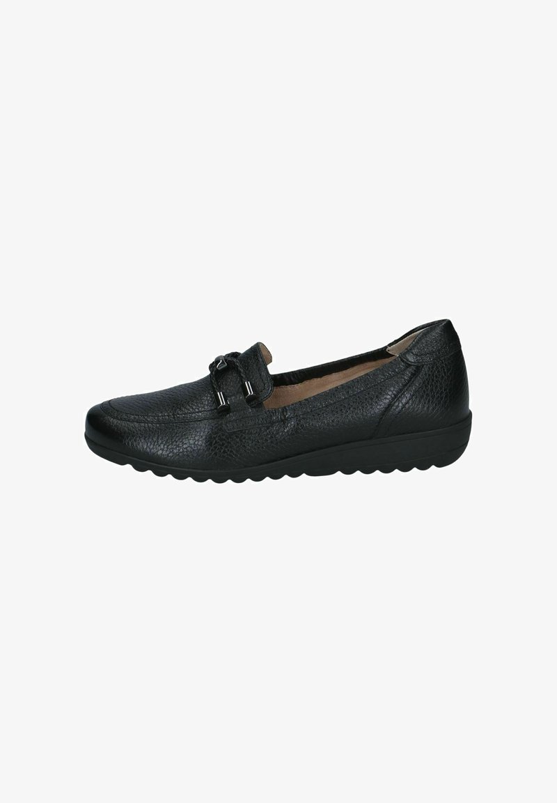 Chaussure en cuir noir texturé, sans lacets, avec une semelle basse à rainures et un nœud décoratif sur l'avant supérieur.