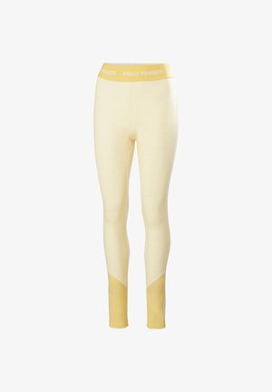 Lichtgele leggings met een brede tailleband met het logo "HELly Hansen". Zachte textuur met contrasterende gele panelen op de onderbenen.