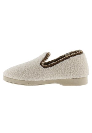 Zapatilla tipo pantufla en color blanco roto con tejido de textura difusa, ribete marrón alrededor de la apertura y suela de goma plana.