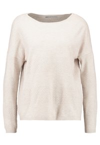 Pull beige clair avec une coupe loose. Présente des motifs texturés, un large col, et des manches longues. Fabriqué en matériau tricot doux.