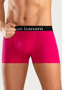 Fuchsia men's boxer briefs with a black waistband featuring "ano banani" in silver. Designed with a snug fit and smooth texture.