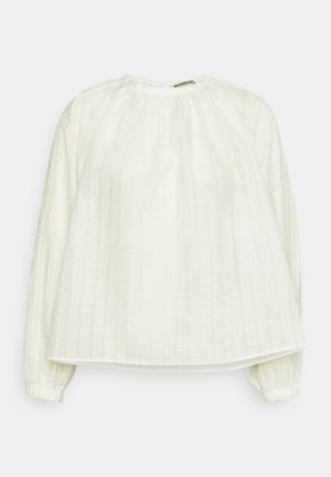 Textuur witte blouse met een ronde halslijn, lange mouwen met elastische manchetten en een losse pasvorm; beschikt over verticale plooien overal.