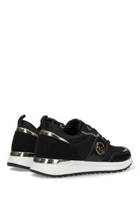 Black athletic sneakers with a textured upper, gold accents, and a thick white sole. Features logo and lace-up design.