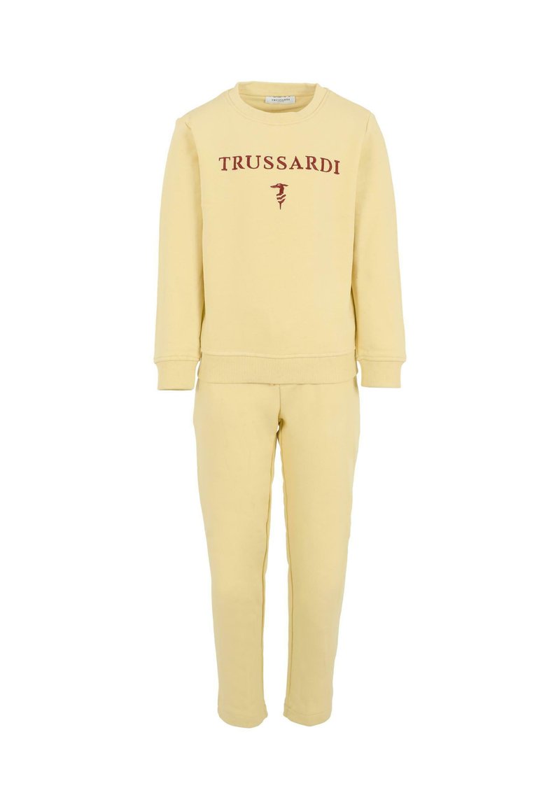 Geel sweatshirt en bijpassende broekset met "TRUSSARDI" in kastanjebruin op de voorkant. Zachte stof met ribgebreide boorden en zoom. Eenvoudig ontwerp.
