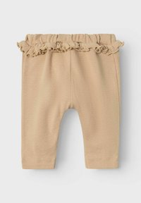 Pantaloni beige per bambino con una cintura arricciata, tessuto testurizzato e gambe affusolate, caratterizzati da un sottile motivo a coste in tutta la superficie.