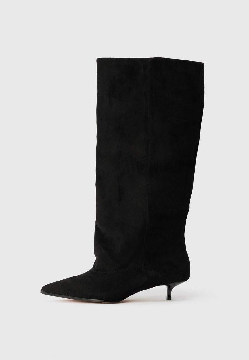 Black suede knee-high boots with a pointed toe and a small kitten heel. Smooth texture with a simple, seamless design.