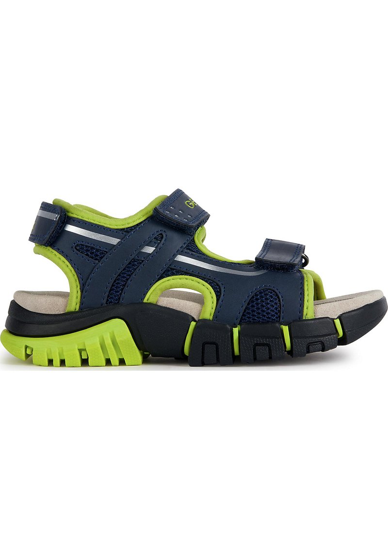 Navy blue sandal with green accents, made of synthetic material. Features mesh panels, adjustable straps, and a textured rubber sole.