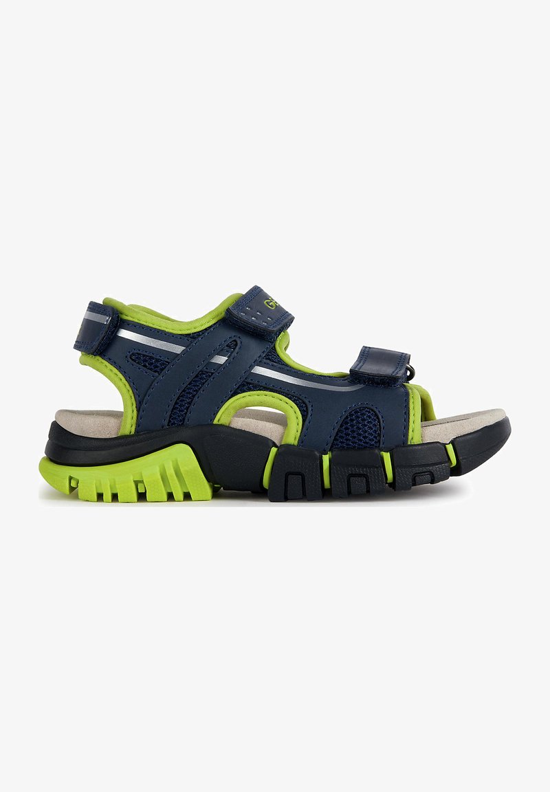 Navy blue sandal with green accents, made of synthetic material. Features mesh panels, adjustable straps, and a textured rubber sole.