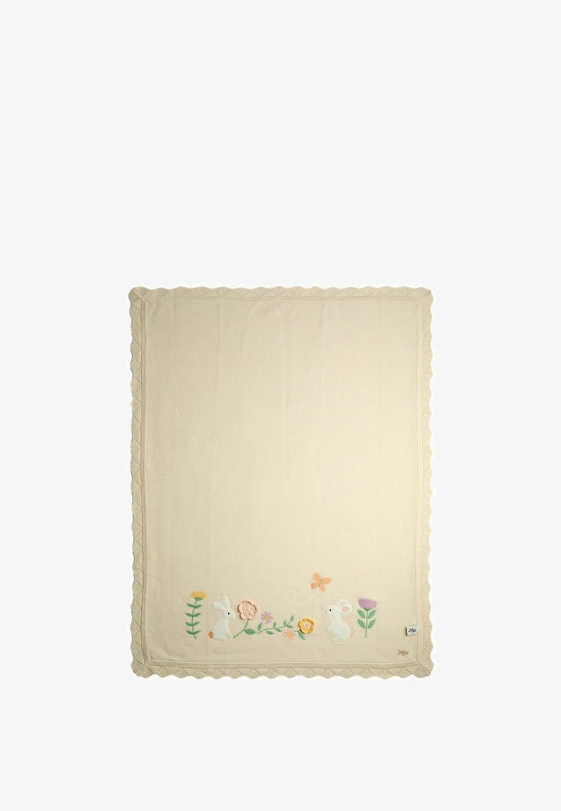 Cream-colored blanket with embroidered bunnies, flowers, and a butterfly along one edge with scalloped trim.