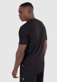 Smilodox LUMIN - T-shirts basic - schwarz