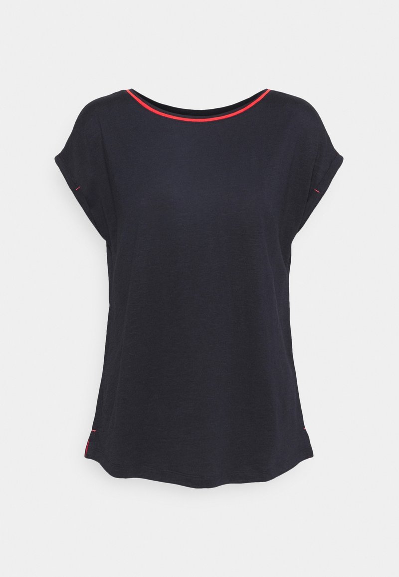 Haut noir à manches courtes pour femme, coupe ample avec bordure rouge le long de l'encolure et des bords des manches.