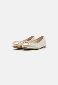 Gold ballet flats with a textured fabric upper and smooth metallic toe. Features a bow detail on the front and a low heel.