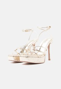 Simmi London MOON - Magas sarkú szandálok - gold-coloured