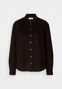 Chemise noire à manches longues avec col, comportant des boutons visibles à l'avant et des poignets ajustés sur les manches.