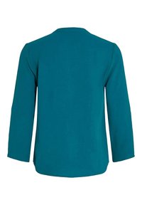 Chemise à manches longues couleur sarcelle avec un col rond, vue de dos, avec un ourlet droit et sans motifs ni logos visibles.