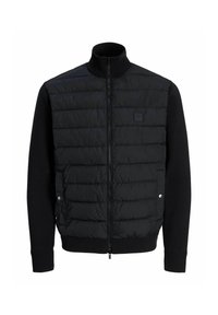 Schwarze Pufferjacke mit Reißverschluss vorne, ausgestattet mit einem gepolsterten oberen Bereich und gestrickten unteren Ärmeln sowie Saum. Beinhaltet einen hohen Kragen und dezente Markenkennzeichnung.