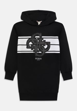 Schwarzer Kapuzenpullover mit großem dekorativem Logo auf der Vorderseite, umrandet von Strasssteinen, mit weißen horizontalen Streifen.