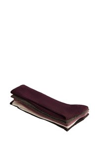 Set di quattro paia di calzini in vari colori: borgogna scuro, grigio, granata e crema. Texture a coste con bande di colore a contrasto sulla parte superiore.