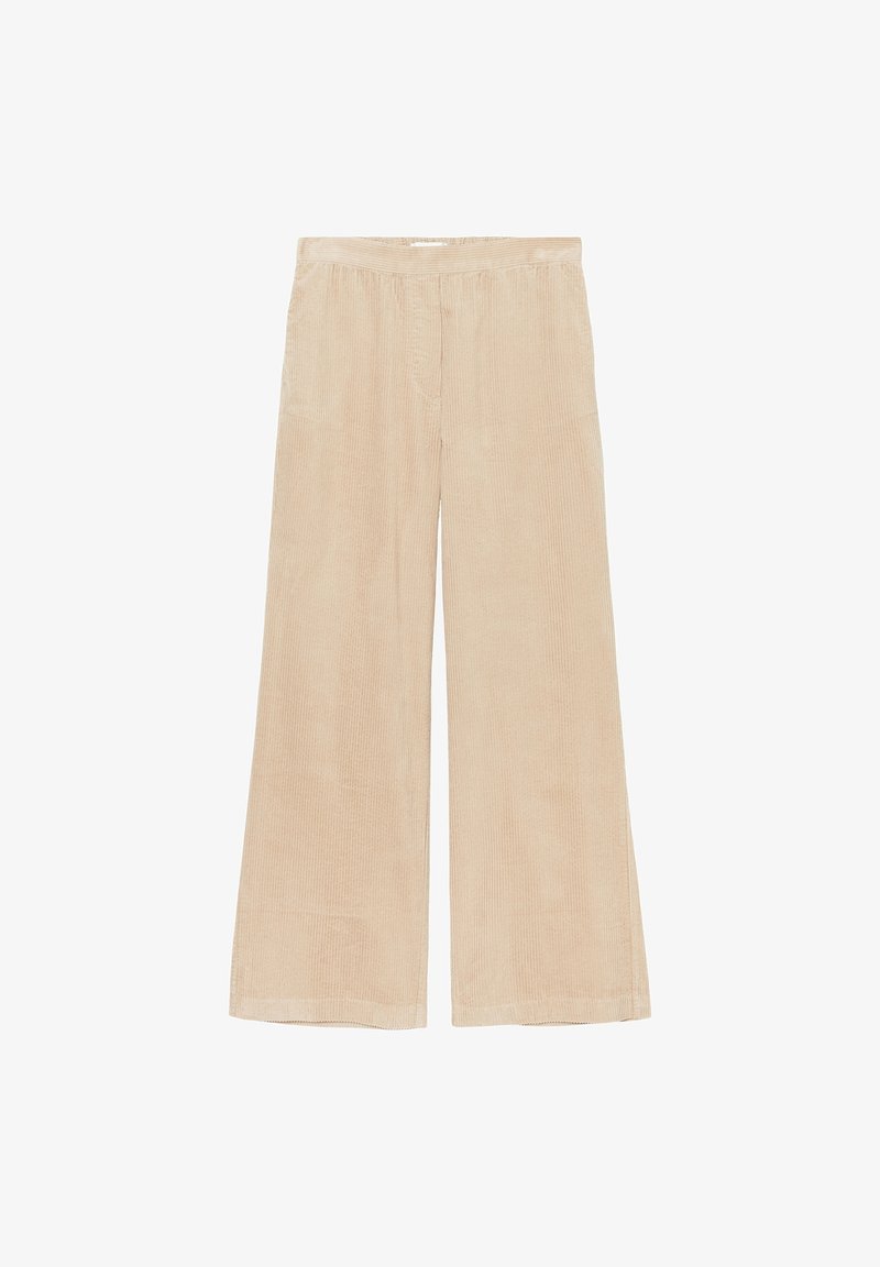 Pantalons en velours côtelé beige à jambe large avec une taille élastique. Texture en côtes verticales, longueur complète, sans fermetures ni poches visibles.