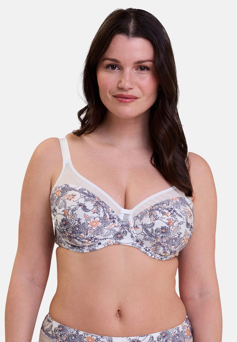 Sujeción floral con base blanca; cuenta con un suave borde de encaje, tirantes ajustables y aros para soporte. Detalles en naranja y azul marino.