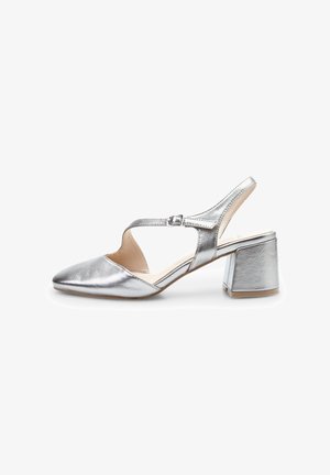 Silver metallic slingback shoe with a pointed toe and a chunky heel. Features a cut-out design and adjustable buckle strap. Smooth texture.