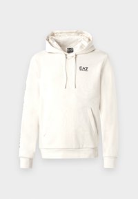 Light cream hoodie with a front kangaroo pocket, drawstring hood, ribbed cuffs, and a small black printed logo on the chest and sleeve.