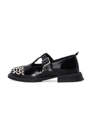 Black patent leather shoe with a T-strap, featuring a leopard print cap toe and a sturdy black sole. Adjustable buckle detail included.