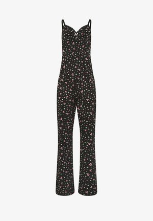 Ensemble de pyjama noir sans manches avec fines bretelles, présentant un petit imprimé floral rose et blanc, pantalon ample et bordure en dentelle au niveau du décolleté du haut.