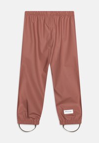 Voděodolné dětské kalhoty v růžové barvě s elastickým pasem a smyčkami na kotnících. Hladký povrch, minimální branding na lemu.