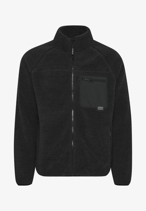 Čierna flísová bunda s vysokým golierom. Predný zips a náprsní vrecko so zipsom. Mäkký, textúrovaný materiál.